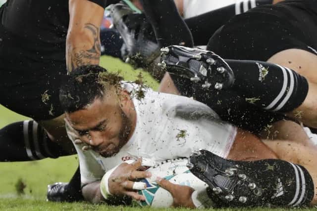 The outstanding Manu Tuilagi scores England's try against New Zealand. Picture: Eugene Hoshiko/AP