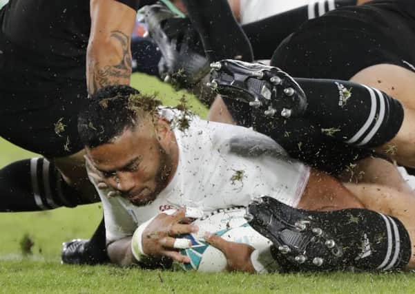 The outstanding Manu Tuilagi scores England's try against New Zealand. Picture: Eugene Hoshiko/AP