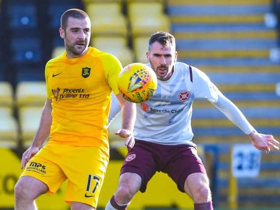 Hearts struggled against a solid Livi side who were still comfortable despite playing 40 minutes with ten men. Picture: SNS