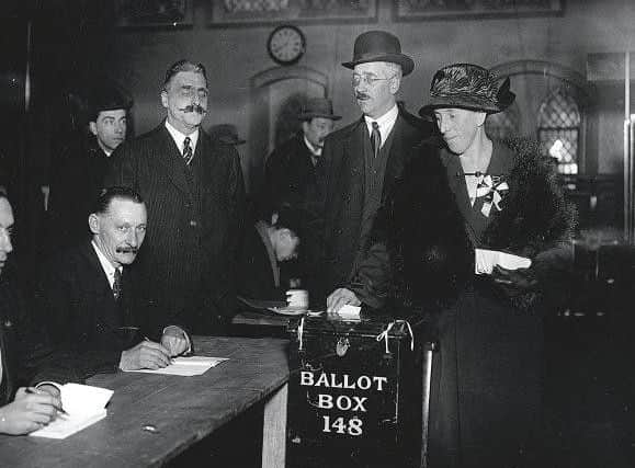 December 1923:  Mrs Mawbey is the first voter at the polling booth in Dulwich in the election of December 1923. Picture: Topical Press Agency/Getty Images