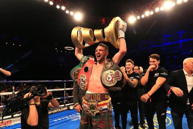 Josh Taylor with the Muhammad Ali Trophy and IBF and WBA belts. Picture: Getty Images