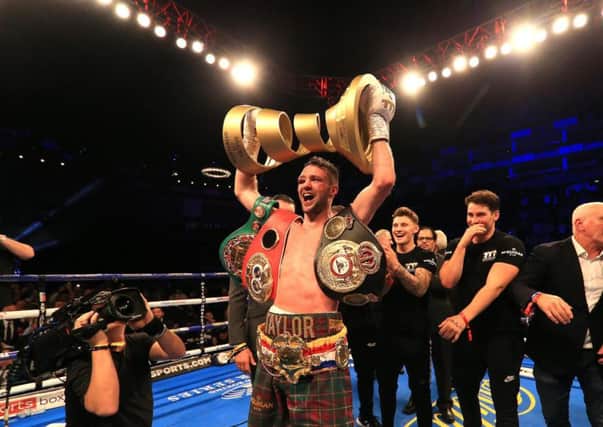 Josh Taylor with the Muhammad Ali Trophy and IBF and WBA belts. Picture: Getty Images