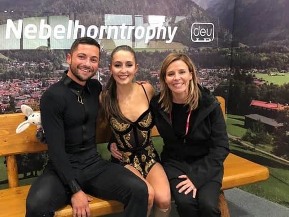 Lewis Gibsoin and Lilah Fear with a member of their coaching team, Josee Piche, at the Nebelhorn Trophy in Germany in September.