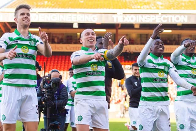 Celtic's victorious players celebrate at full-time. Picture: SNS