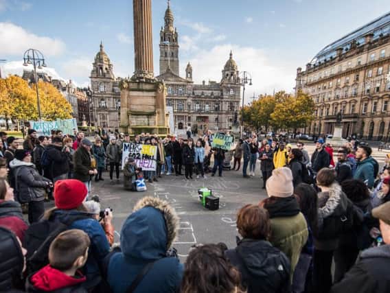George Square is where people go to protest, to party, and to sit out in the sun. Picture: John Devlin