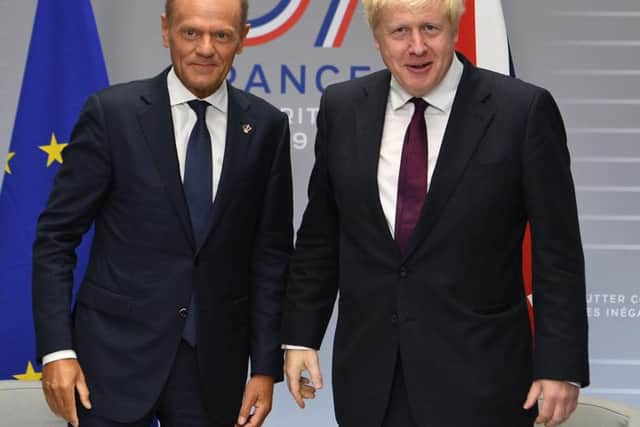 Donald Tusk with Boris Johnson. Picture: PA