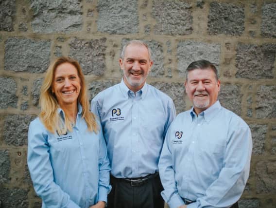 Jim Grimmer, pictured centre, with business partners Jeannette Mackay and Lachlan McPhee. Picture: Contributed