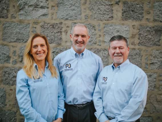 Jim Grimmer, pictured centre, with business partners Jeannette Mackay and Lachlan McPhee. Picture: Contributed