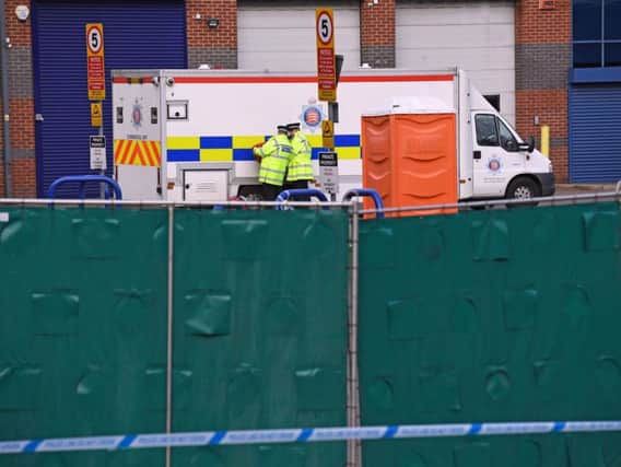 The scene as bodies were moved. Picture: PA