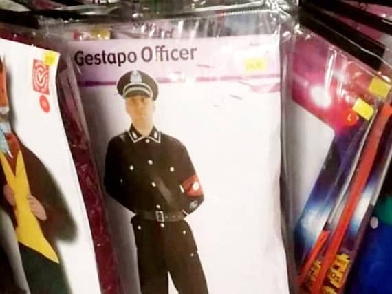 he 35 'Gestapo Officer' costume includes a hat, button up shirt, trousers, boots and red armband.