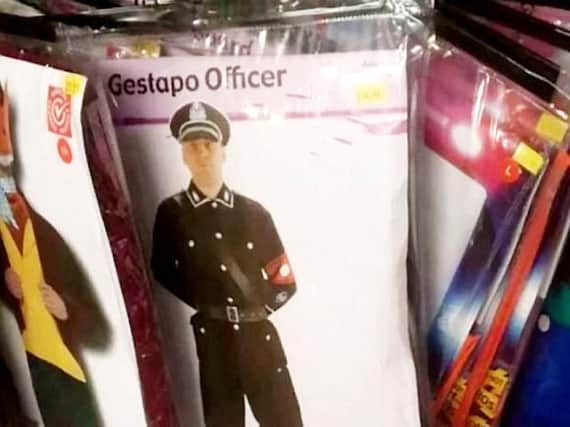 he 35 'Gestapo Officer' costume includes a hat, button up shirt, trousers, boots and red armband.