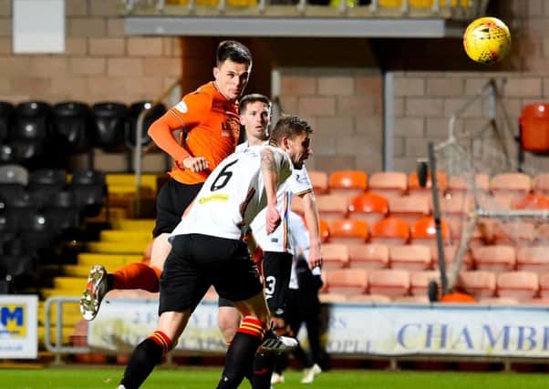 Lawrence Shankland heads home Dundee United's winner in the 62nd minute.