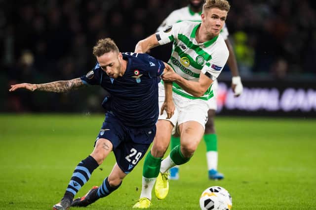 Celtic's Kristoffer Ajer battles for the ball with Lazio's Manuel Lazzari
