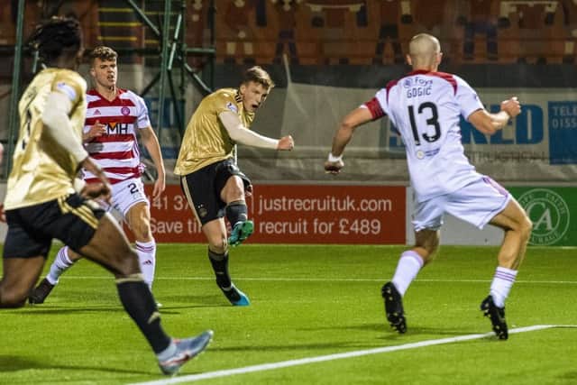 Aberdeen midfielder Lewis Ferguson fires home the only goal of the night against his former club. Picture: Sammy Turner/SNS