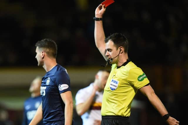Kilmarnock's Alex Bruce is shown the red card by feferee Don Robertson after 13 minutes.