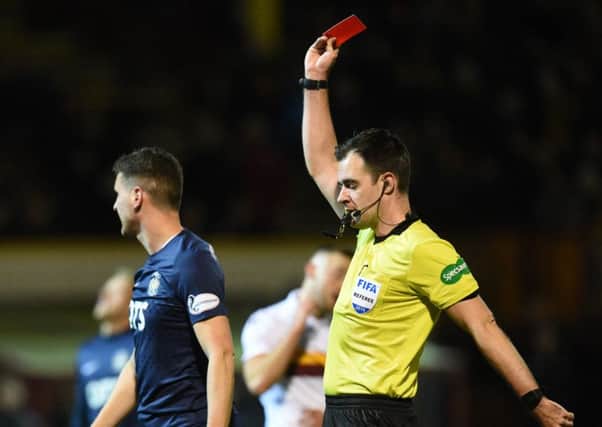 Kilmarnock's Alex Bruce is shown the red card by feferee Don Robertson after 13 minutes.
