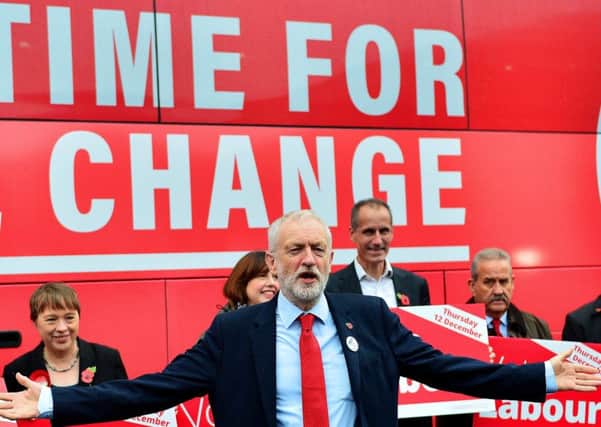 This is either Kevan Christie in a Jeremy Corbyn mask, or the Labour leader himself. We can't tell. (Picture: Richard Martin-Roberts/Getty Images)