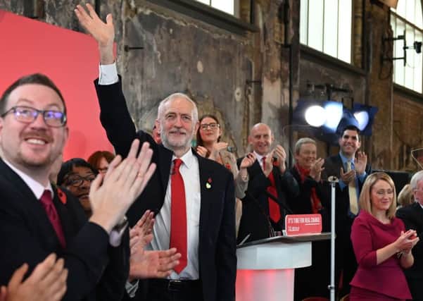 Jeremy Corbyn waves to a cheering crowd of supporters as he launches the Labour election campaign (Picture: Daniel Leal-Olivas/AFP via Getty Images)