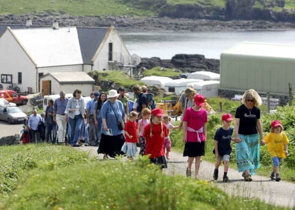 Residents of Eigg celebrate the tenth anniversary of its community buyout (Picture: Jane Barlow)