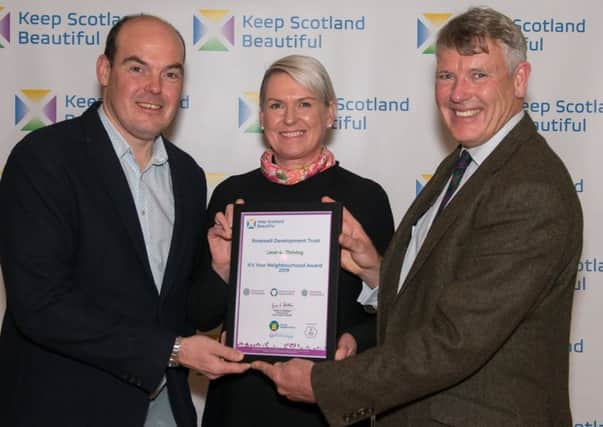Pictured:  (from left to right)  Robert Scott, Rosewell Development Trust Manager, Lynn Pillians, Trust Director are presented the award by Tom Brock, OBE, Interim Chief Executive, Keep Scotland Beautiful. Photo by Angus Findlay.