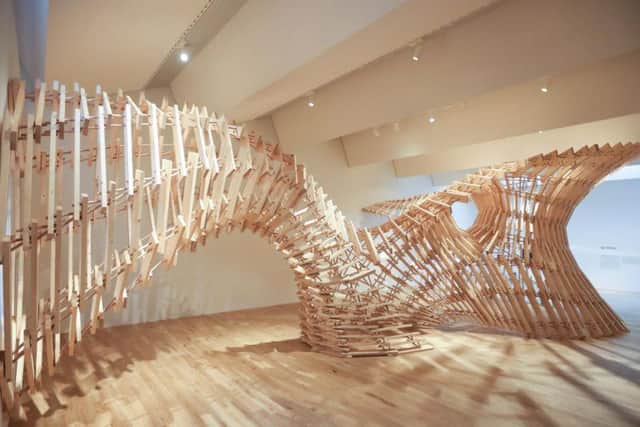 The Up-Sticks sculpture is said to be inspired by the timber frame architecture of the traditional Scottish croft.