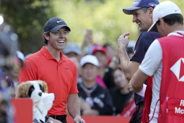 Rory McIlroy has a laugh about something during his second round in the HSBC Champions in Shangai. Picture: AP