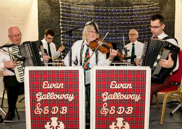The Ewan Galloway Scottish Dance Band, led by Ewan from Dalkeith,  pictured on the right hand side(red trousers) playing accordion.