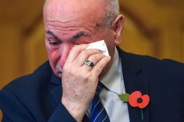 El Alami Hamdan, who lost his son-in-law and two grandchildren, wipes the tears as relatives of those who died in the Grenfell Tower fire hold an emotional press conference following the release of findings from phase one of the Grenfell Tower inquiry (Picture: Peter Summers/Getty Images)