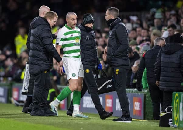 Celtic captain Scott Brown leaves the field after picking up a knock against St Mirren on Wednesday and remains doubtful today. Picture: SNS.