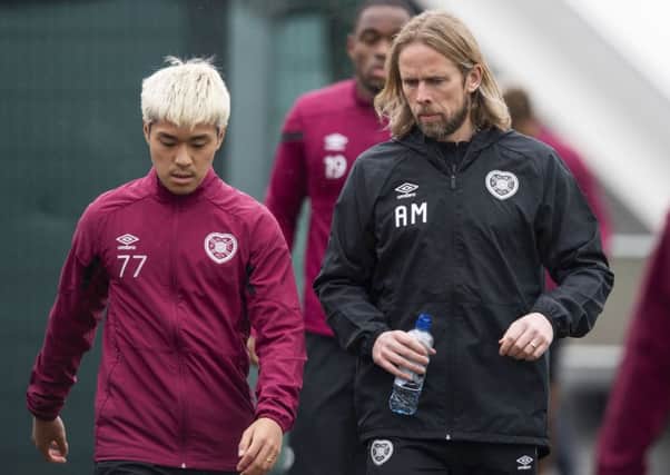 Hearts' interim manager Austin McPhee makes a point to loan attacker Ryotaro Meshino.Picture: Ross Parker/SNS