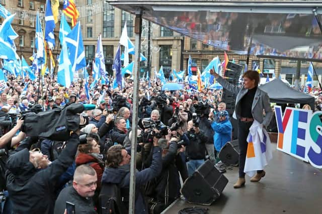 Nicola Sturgeon on stage at the pro-independence rally in Glasgow, where she called for an IndyRef2 to take place next year. Picture: PA