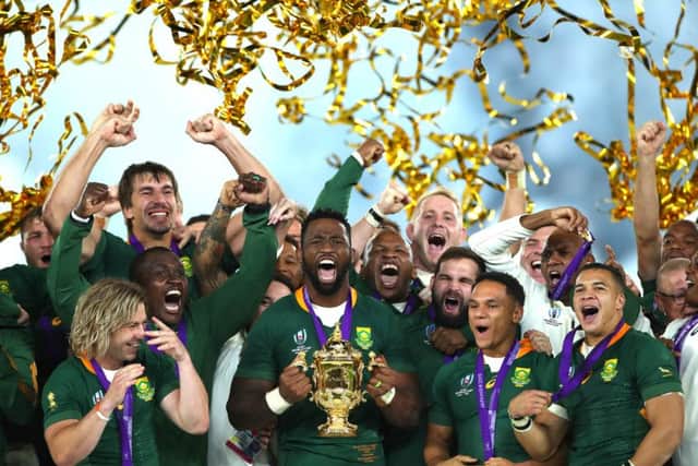 Players of South Africa celebrate as captain Siya Kolisi lifts the Web Ellis Cup following their victory over England. Picture: Cameron Spencer/Getty Images