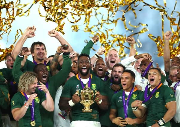Players of South Africa celebrate as captain Siya Kolisi lifts the Web Ellis Cup following their victory over England. Picture: Cameron Spencer/Getty Images
