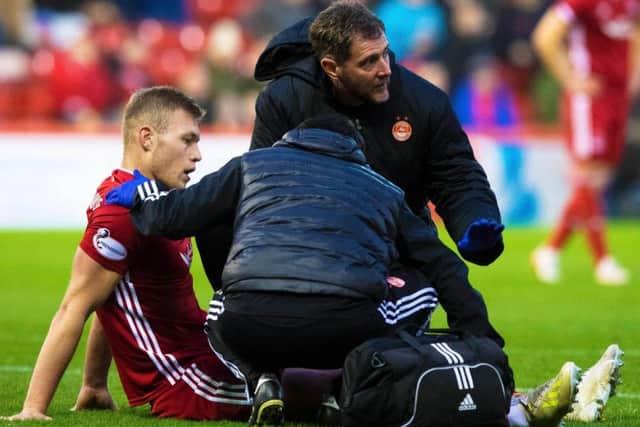 Sam Cosgrove was forced off through injury for Aberdeen. Picture: SNS