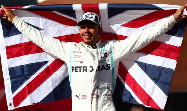 Lewis Hamilton celebrates after clinching his sixth world championship with a second-place finish at the Circuit of The Americas. Picture: Dan Istitene/Getty Images
