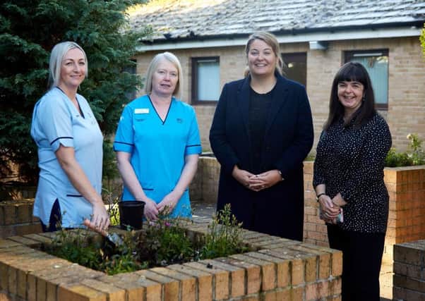 Kirsty Lewis Asst Practitioner, Jenny Preston, Clinical Lead Neurological Rehabilitation, Ruth McGuire, MSP and Alison Keir Policy Officer Scotland  at the garden where OT takes place.