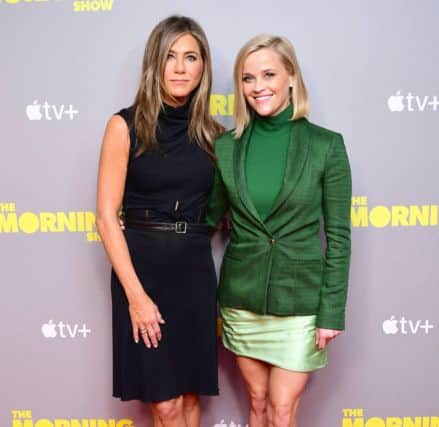 Jennifer Aniston, with Reese Witherspoon at a screening of Apple's the Morning Show held in London, repoortedly gets up at 3am to go to the gym (Picture: Ian West/PA Wire)