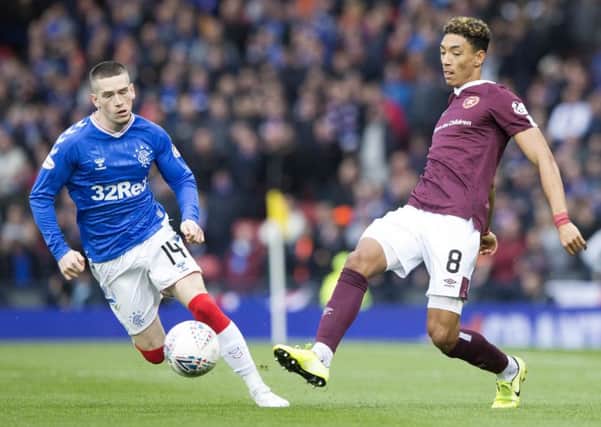 Ryan Kent, left, in action against Hearts on Sunday, says he needs more game time before getting back to his best. Picture: PA.