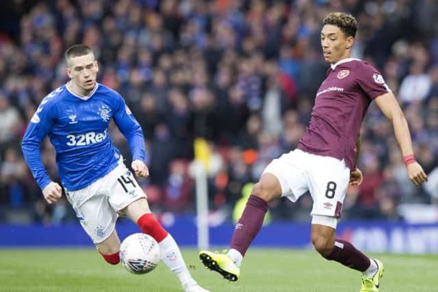 Ryan Kent, left, in action against Hearts on Sunday, says he needs more game time before getting back to his best. Picture: PA.
