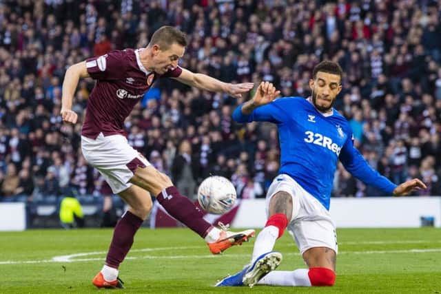 Steven MacLean, left, and Conor Goldson in action at Hampden on Sunday. The Ibrox defender has accused the Hearts striker of over-aggressive tactics. Picture: SNS.