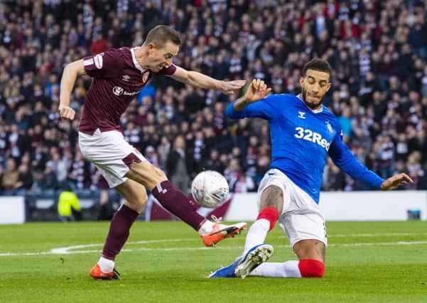 Steven MacLean, left, and  Conor Goldson in action at Hampden on Sunday. The Ibrox defender has accused  the Hearts striker of over-aggressive tactics. Picture: SNS.
