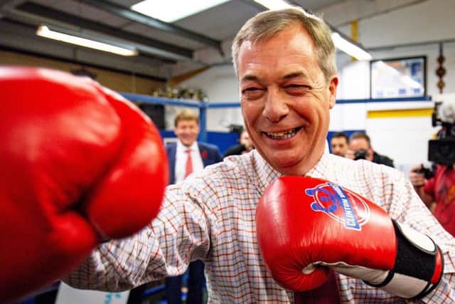 Battling for Brexit or Remainers' biggest hope? Nigel Farage on a visit to Bolsover Boxing Club near Chesterfield in Derbyshire (Picture: Jacob King/PA Wire)