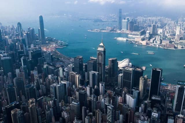 This aerial photo shows the skyline of Hong Kong. (Photo by Dale DE LA REY / AFP)