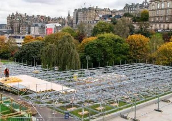 The Christmas market being built in Princes Street Gardens