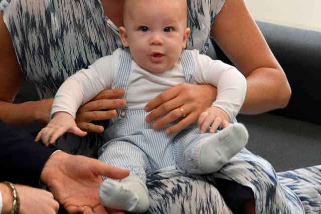 Baby Archie during a meeting with Archbishop Desmond Tutu.