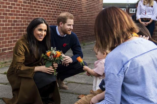 The Duke and Duchess of Sussex have shared details about life with baby son Archie - telling a group of military families he is beginning to crawl.