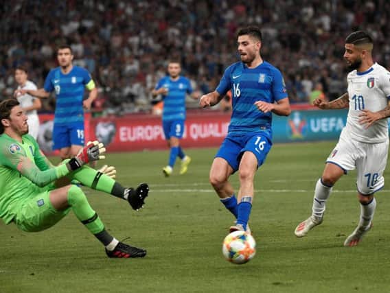 Vasilios Barkas in action (left) for Greece against Italy