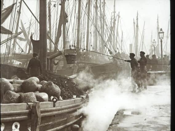 An image by George Washingston Wilson of 19th century herring fisherman in Aberdeen.