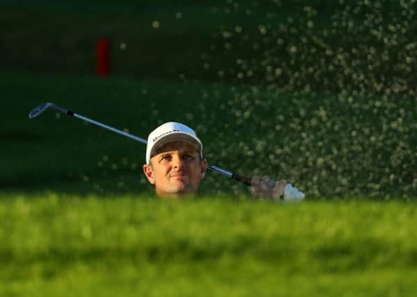 Justin Rose peeks out the bunker at the 18th hole during his opening round at the Turkish Airlines Open in Belek. Picture: Warren Little/Getty Images