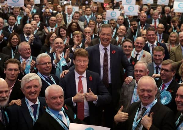 Brexit Party candidates pose with leader Nigel Farage and Brexit Party chairman Richard Tice. (Photo by Dan Kitwood/Getty Images)